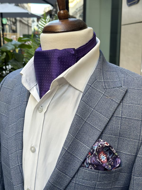 Violet jacquard silk ascot with fine pin dots displayed with a white shirt and gray plaid jacket