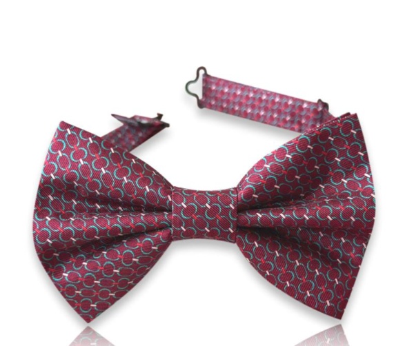 Neven burgundy silk twill bow tie with turquoise circular motifs and an adjustable neck strap on a white background.