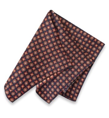 Neven silk twill pocket square with a deep navy base, red medallions, and gold and cream details